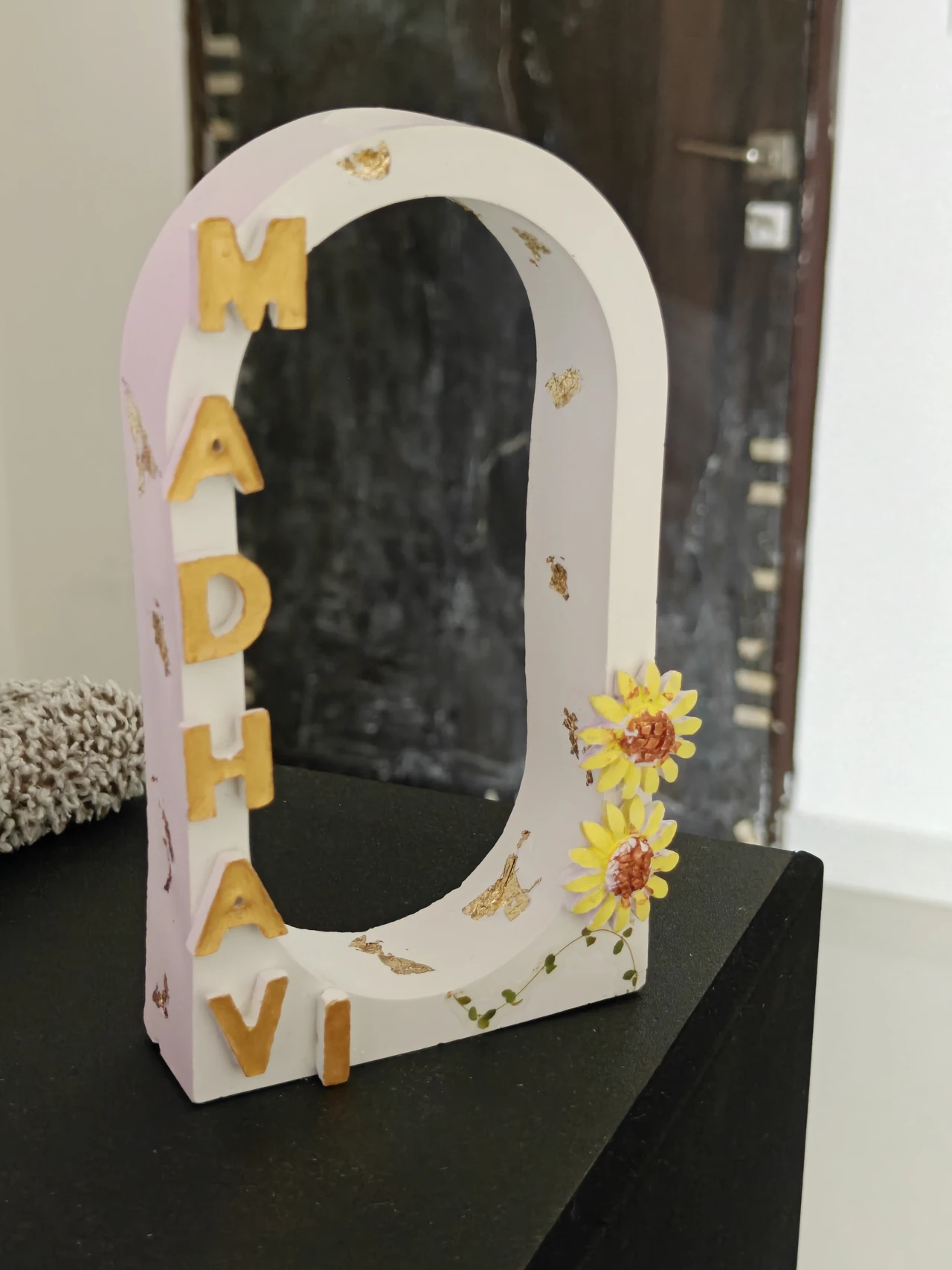 Signature MADHAVI nameplate, supplied sample photograph